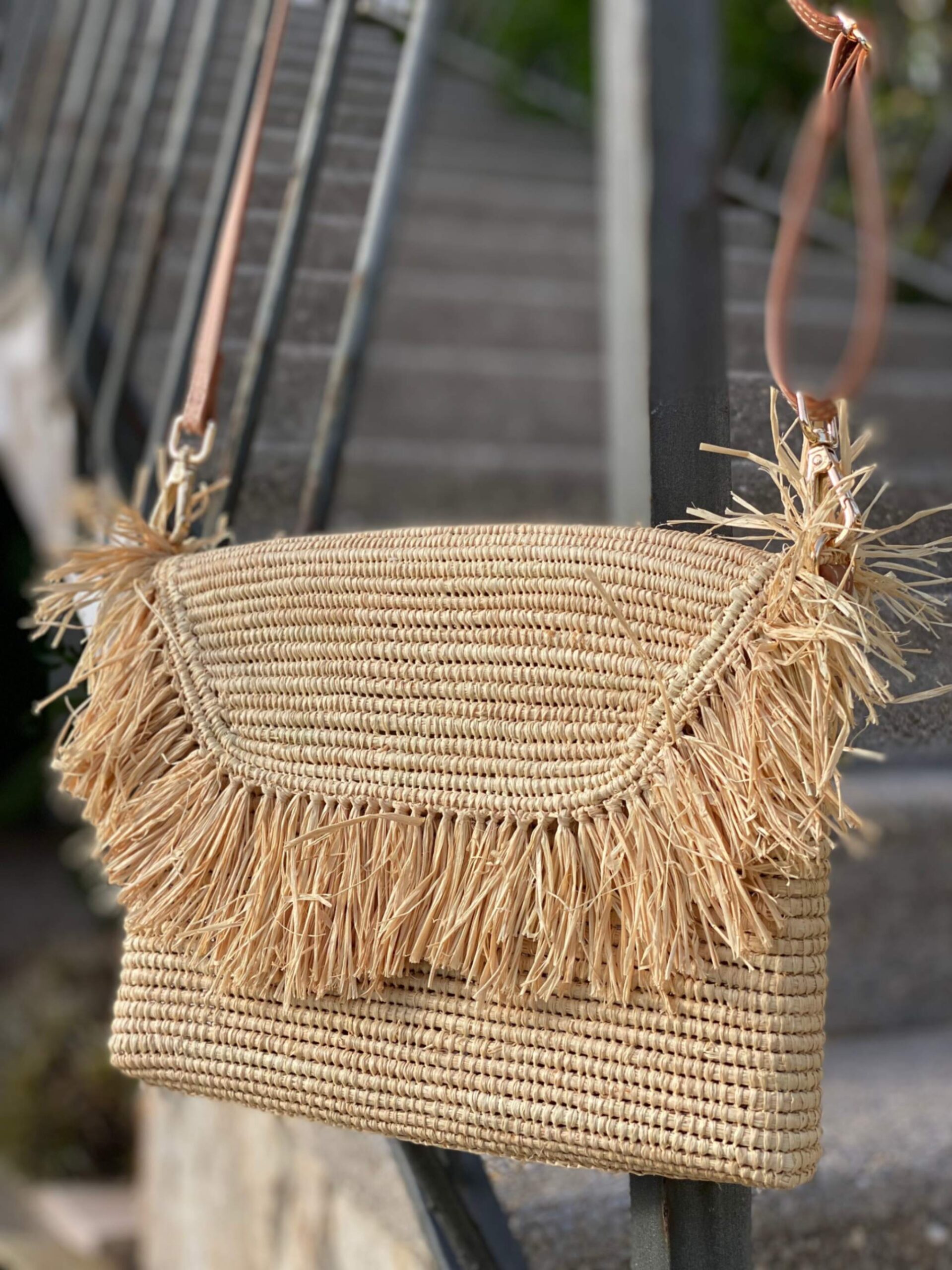 Handmade reed handbag with raffia bangs and long handle