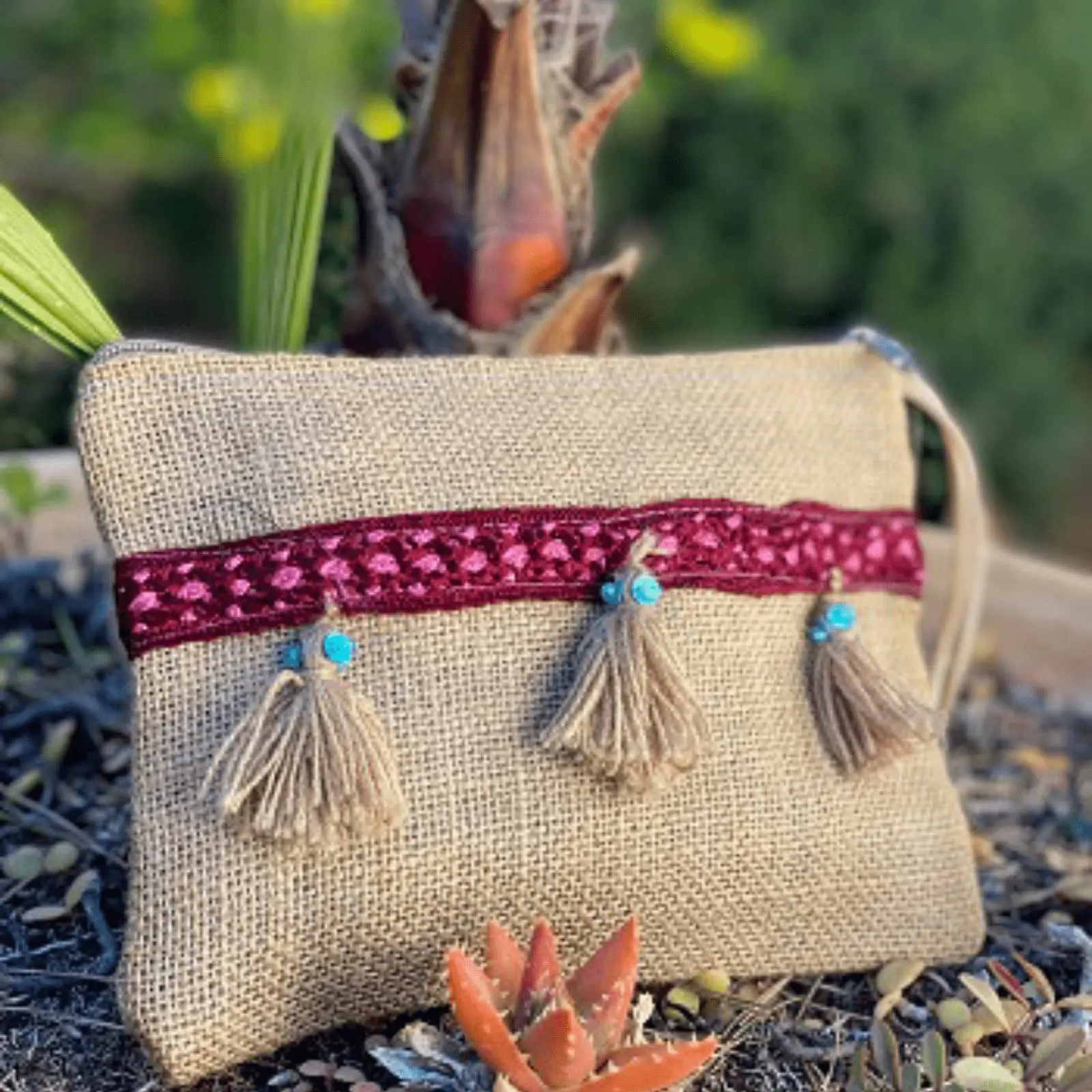 Sack pouch with pompoms and red ribbon decoration