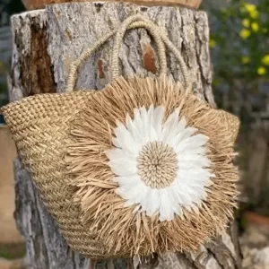 Basket lined with raffia and feathers