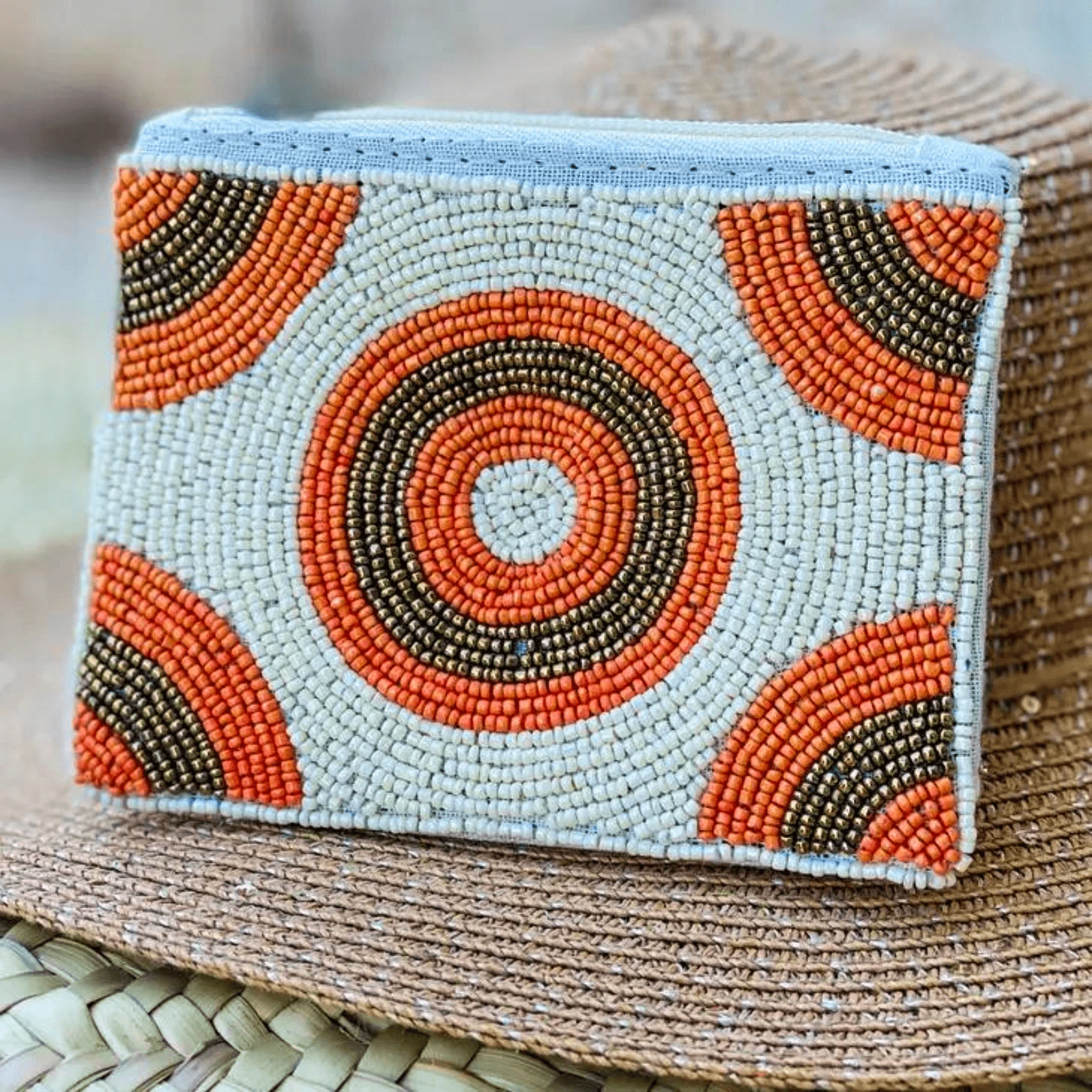 Orange beaded zippered pouch