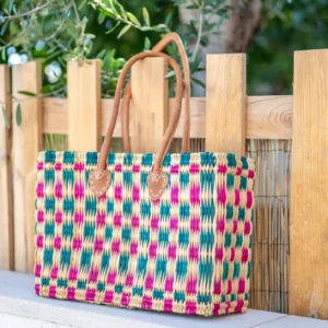 Reed basket with leather handles